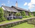 Enjoy a glass of wine at Torver Station Cottages - Station Masters House; Cumbria