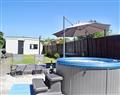 Relax in your Hot Tub with a glass of wine at Ty Bryn Cottage; Mid Glamorgan