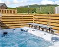 Relax in your Hot Tub with a glass of wine at Vale of Llangollen Farm Cottages - Cor Tarw; Denbighshire
