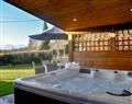 Relax in your Hot Tub with a glass of wine at Vindomora County Lodges - Housesteads Lodge; Northumberland