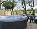 Relax in your Hot Tub with a glass of wine at Wallace Lane Farm Cottages - Kestrel Cabin ; Cumbria