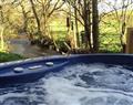 Relax in your Hot Tub with a glass of wine at Water Mill Holidays - The Old Tearoom; Cumbria