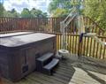 Relax in your Hot Tub with a glass of wine at Wheelchair-adapted Silver Birch at Keldy; ; North Yorkshire