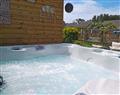 Relax in your Hot Tub with a glass of wine at Willow Tree Lodge; Isle of Wight