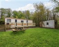 Enjoy a glass of wine at Woodland Caravan; ; Llannor near Y Ffor