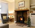 Enjoy a glass of wine at Woodland Cottage; Cumbria
