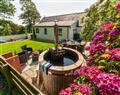 Relax in your Hot Tub with a glass of wine at Yr Hen Glowty; Dyfed